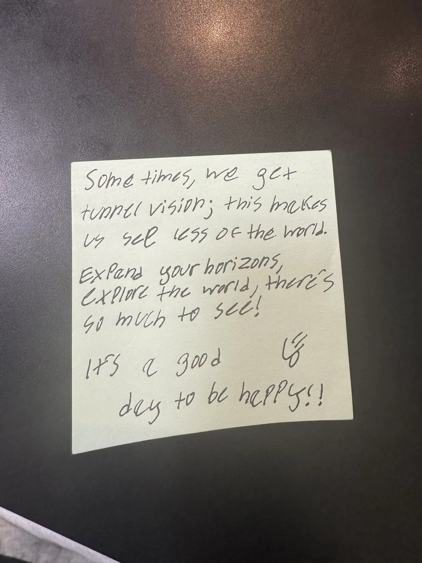 Handwritten sticky note with words of encouragement